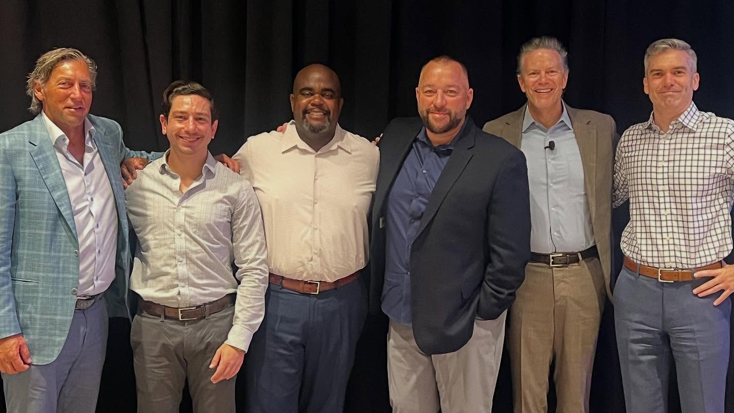 Group photo of Glenn Thomas with colleagues at the Willis Towers Watson conference, representing Full Spectrum Safety Consulting.